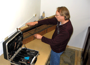 Piano actions require hundreds of adjustments.